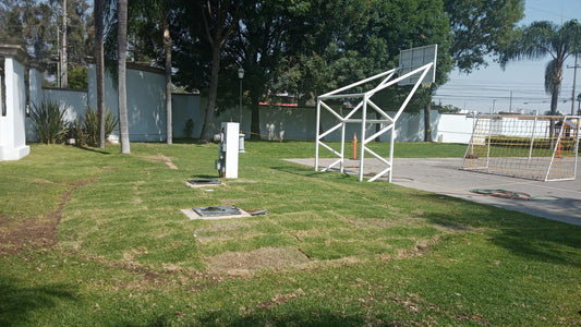 l) Reubicación controles de riego junto basquet.